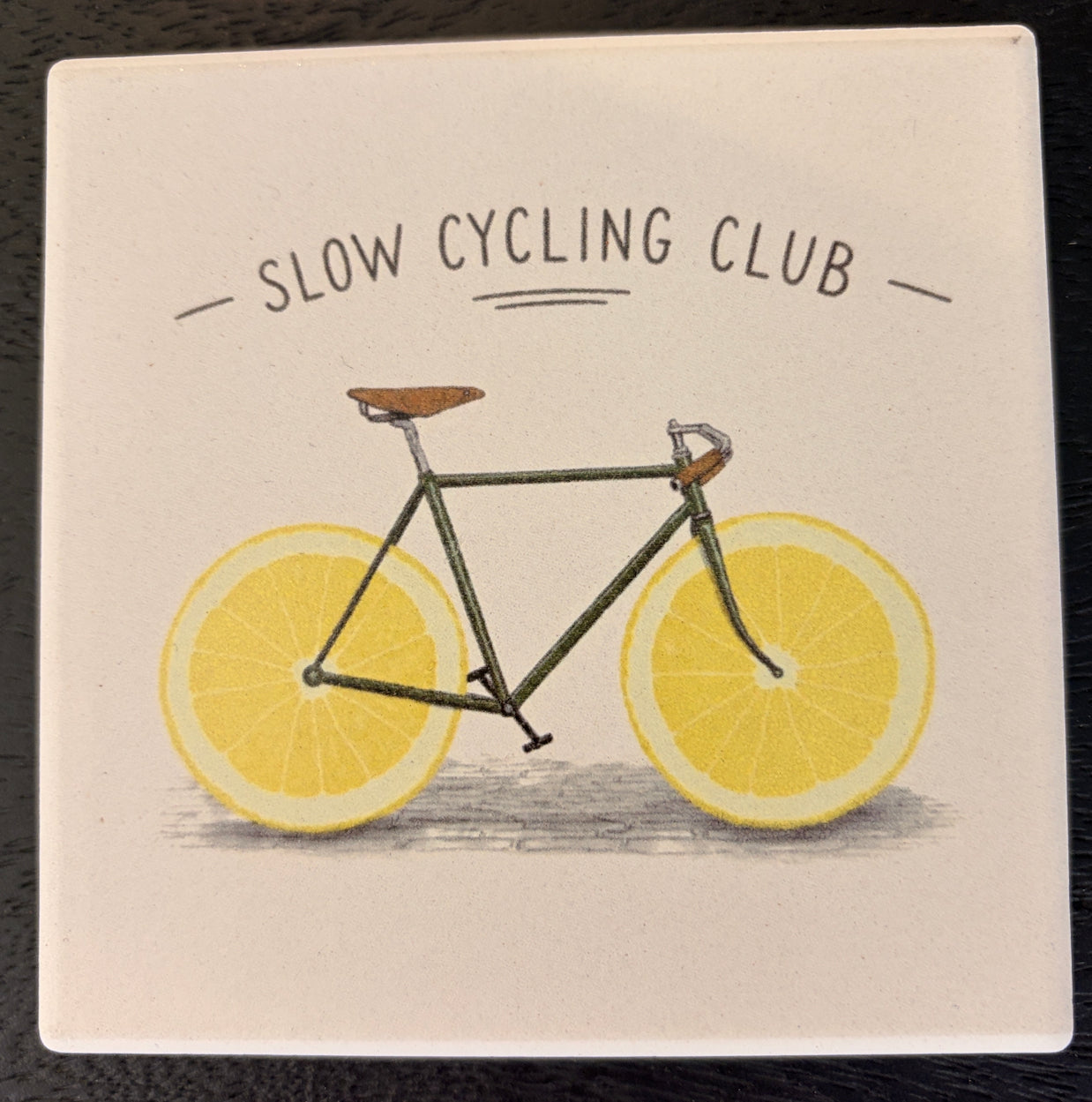 files/fliese-untersetzer-slow-cycling-club-zitrone-fahrrad.jpg