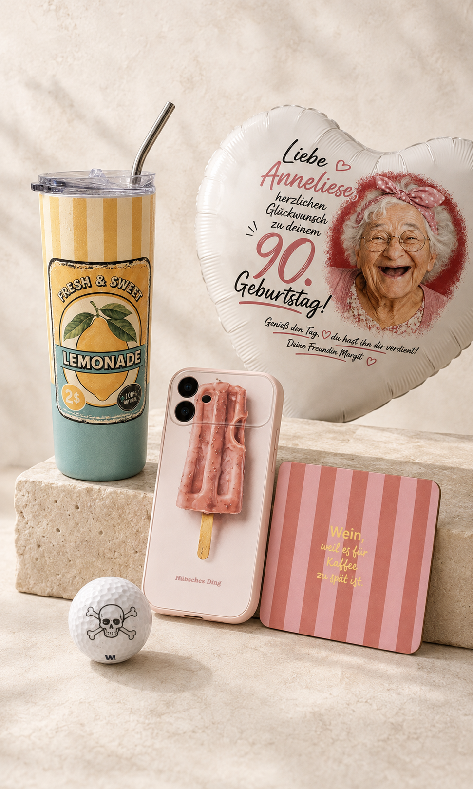 Personalisierte Geschenke von Hübsches Ding mit Thermobecher, Handyhülle, Untersetzer, Folienballon und bedrucktem Golfball.